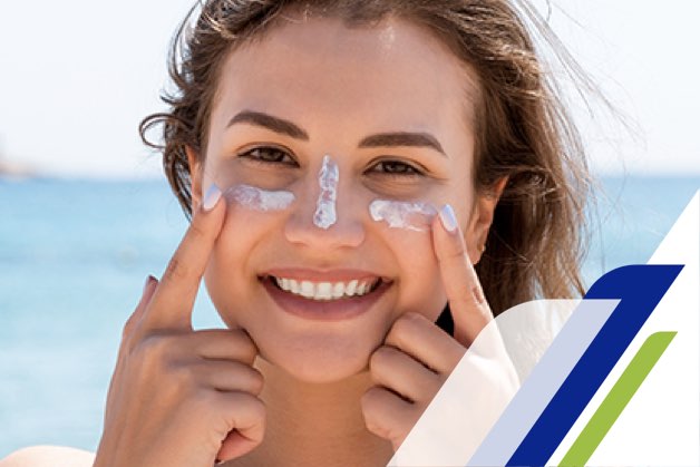 Girl on a beach with a cream on her face